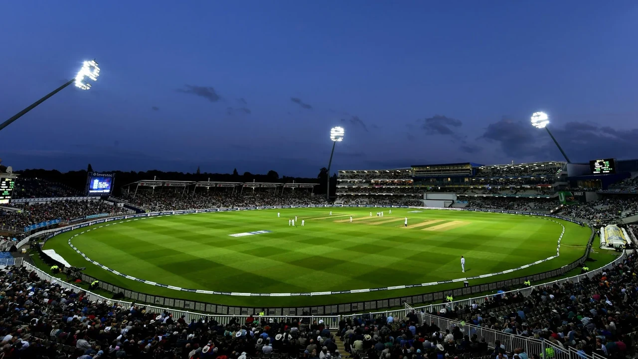 A floodlit cricket stadium prepared for an evening match