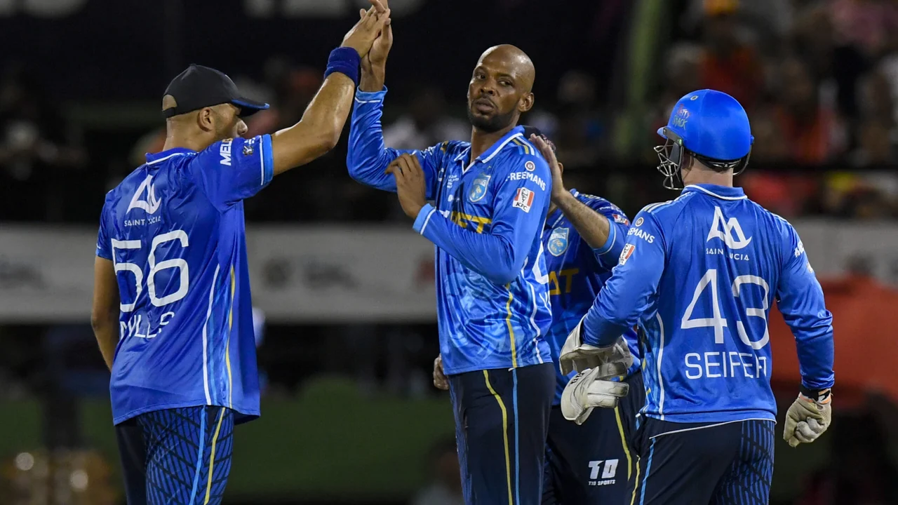CPL players celebrating a wicket under stadium lights